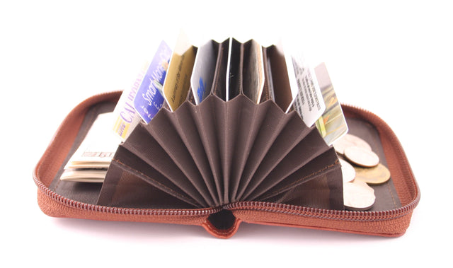 Storus Smart Accordion Wallet open and fanned filled with money and cards