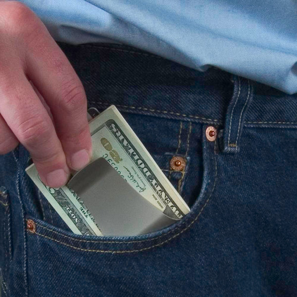 Storus® Smart Money Clip - polished Stainless - clip side shown being placed in a front jeans pocket - patented #ScottKaminski #Storus #man #moneyclip #wallet #lovethisproduct #mensaccessories