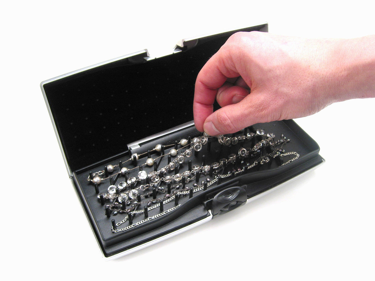 Storus Smart Jewelry Case® open view peg side grabbing a necklace